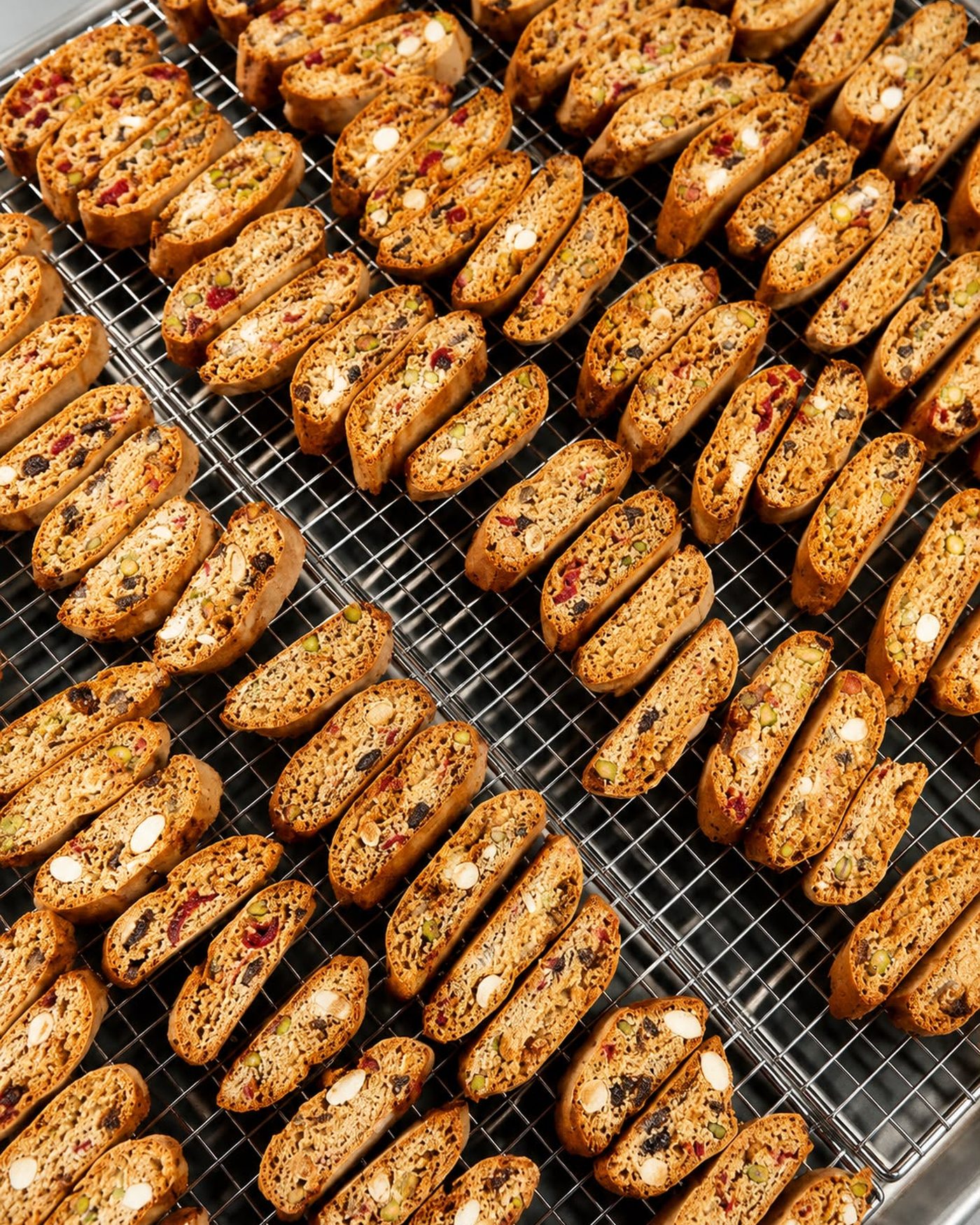 Trays of cantucci biscotti cooling on wire racks